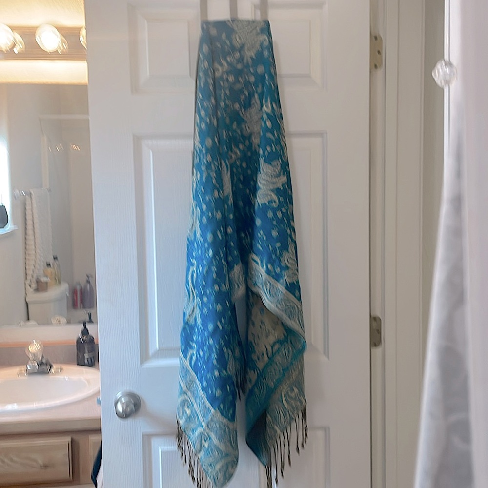 Beautiful scarf/shawl. Blue and gold with fringe on the bottom. Never worn.